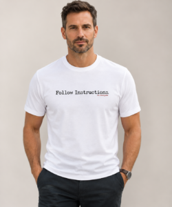 Man wearing white Follow Instructions minimal typewriter tee