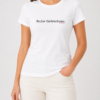 Woman wearing white Follow Instructions minimal typewriter tee