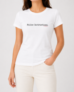 Woman wearing white Follow Instructions minimal typewriter tee