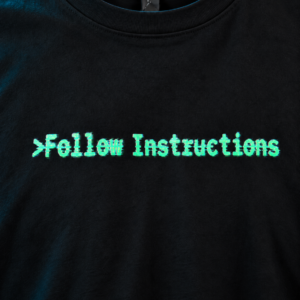 Close-up of Follow Instructions Glitched layered offset typography print